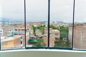 a view of a city from a window at Solay Inn in Ayacucho