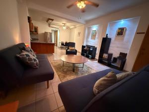 a living room with a couch and a table at Ideal beach getaway in Nenúfares 2-101 in Nuevo Vallarta