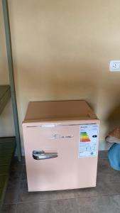 a white refrigerator with a box on top of it at Parador Diaguita in El Peñón