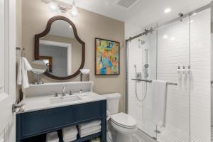 a bathroom with a sink and a toilet and a shower at The Shepherd Hotel Downtown Clemson in Clemson +22 photos