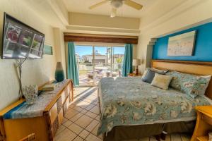 a bedroom with a bed and a view of a patio at Las Palmas Resort in Puerto Peñasco +290 photos