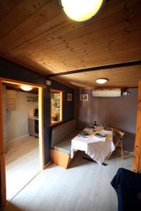 a room with a table and a couch in a room at Apartment Haus Jasmin by Interhome in Castagneto Carducci +19 photos