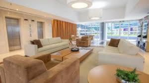 a living room with a couch and a table at Alugueasy - Hotel Vision in Brasília