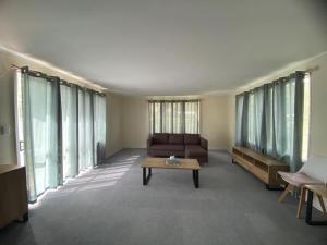 a living room with a couch and a coffee table at Lagoon House in Veitongo