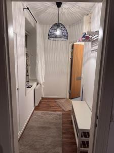a hallway with a hallway leading to a room at Asken 8 in Klippan