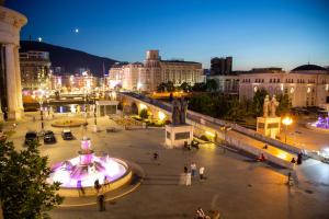 a view of a city at night at Stone Bridge 24 Apartment in Skopje