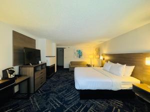 a hotel room with a bed and a television at Best Western Sault Ste. Marie in Sault Ste. Marie