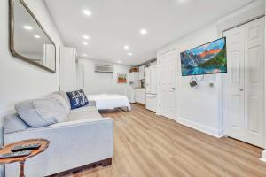 a living room with a couch and a bed at 127 Hwy 71 AT Bunk House in Arnolds Park