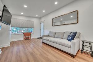 a living room with a couch and a mirror at 127 Hwy 71 AT Bunk House in Arnolds Park
