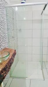 a bathroom with a glass shower with a sink at Relax Private Room - Santo André, BA in Santo André