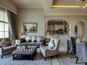 a living room with a couch and a table at Mövenpick Resort Khao Yai in Ban Wang Sai +143 photos