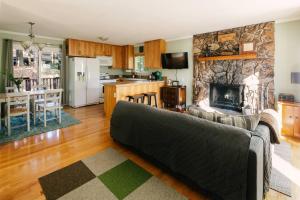 a living room with a couch and a fireplace at Peaceful Mountain Sanctuary near Arrowhead Village in Lake Arrowhead
