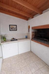 a kitchen with a sink and a counter top at Casa de campo in Puerto Madryn