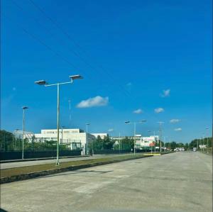 an empty parking lot with street lights and buildings at Loft shaula in Tapachula