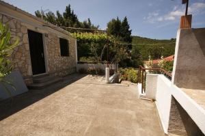 a patio of a house with a building at House Paulo1 in Rogačić +15 photos