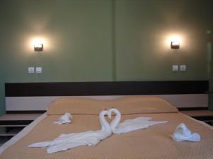 Ein Bett oder Betten in einem Zimmer der Unterkunft Hotel Amfibia