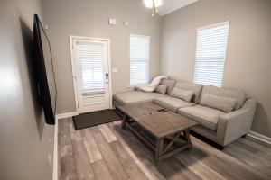 a living room with a couch and a coffee table at Memphis Charm in Memphis