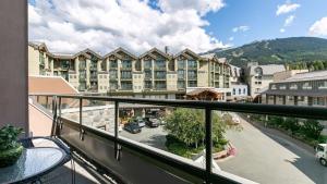 a balcony with a view of a hotel at Adara Hotel in Whistler