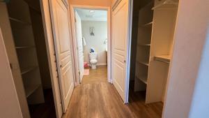 a hallway leading to a bathroom with a toilet at Modern 2BD Apartment with 2 Baths in Alhambra in Alhambra