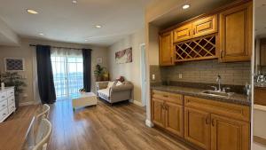 a kitchen with a sink and a couch in a room at Modern 2BD Apartment with 2 Baths in Alhambra in Alhambra
