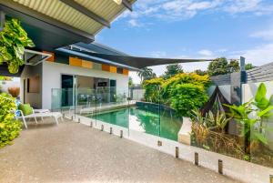 an image of a swimming pool in a house at The Lily Pad Pool Paradise - NT Tourism Award Winner in Paraparap