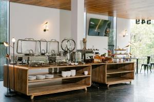 a kitchen with a counter with dishes on it at Khanom Station 549 in Khanom