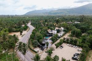 an aerial view of a city with a road at Khanom Station 549 in Khanom