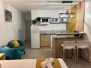 a small apartment with a kitchen and a living room at Studio en bord de mer - létama - Résidence Archipel Savane in Le Gosier