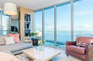 a living room with a couch and a table at Brickell by Miami Vacation Rentals in Miami