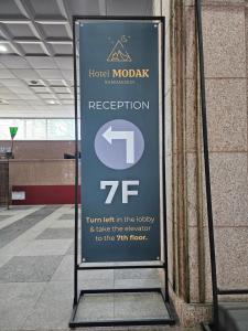 a sign for a hotel motel in a building at Hotel Modak Namdaemun in Seoul