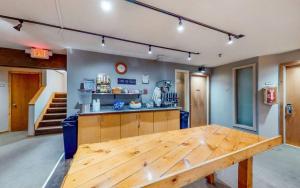 a large wooden table in the middle of a room at 3 bdrm cottage in Predeal in Predeluţ