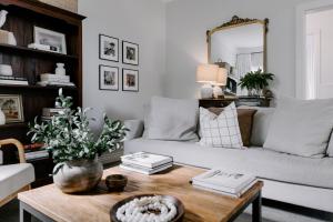 a living room with a couch and a coffee table at Old Maffra Cottage in Maffra