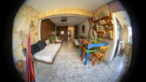 a view of a living room and dining room in a trailer at Hostal Paz y Vida in Medellín