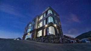 a large building at night with a starry sky at Chuncheon The Van Pool Villa in Chuncheon +18 photos