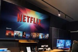 a netflix sign on a wall in a room at Dalbit Sori Hotel Jeonju in Jeonju