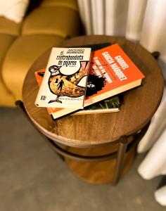 two books are sitting on a table at Cuna 58 in Barranquilla
