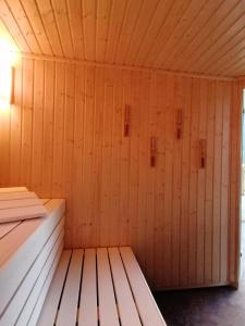 a wooden room with a bench in a sauna at Parkhotel Ropeter in Göttingen