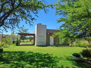 a house in the middle of a yard at Casa de Andres in Ataliva Roca