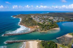 an aerial view of a small island in the ocean at Bungalow Blue - 8 Illawong Lane in Evans Head
