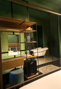 a bathroom with a tub and a sink and a mirror at Cuna 58 in Barranquilla +104 photos