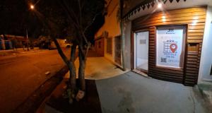 a building with a sign on the side of a street at Hospedaje JyH in Paso de los Libres