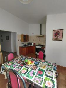 a table with a table cloth with flowers on it at Vallesito in Salsipuedes