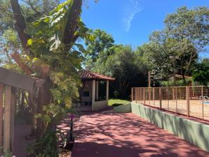 a house with a fence and a walkway at Villa Domus in Barretos