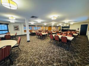 a dining room with tables and chairs at Best Western Sault Ste. Marie in Sault Ste. Marie