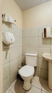 a bathroom with a toilet and a sink at Chalés São Domingos in Barreirinhas +47 photos
