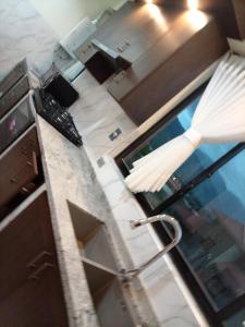 a view of a kitchen with a table and a chair at RoofTop in Kollpa +46 photos