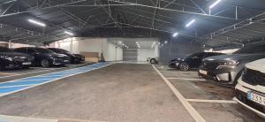 a garage with a bunch of cars parked in it at Hotel Hariu in Gwangju