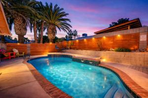 a swimming pool in the backyard of a house at ᨒོ The Good Life - Fun Pool Escape 15 min to Strip in Las Vegas