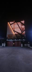 a large building is lit up at night at Hangang M building in Avati