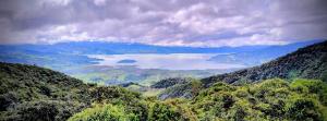 a view of a lake in the middle of a mountain at Chalet Stonehenge in Pasto +5 photos